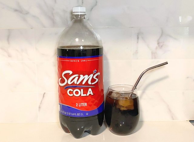 Sam's Cola bottle next to soda glass