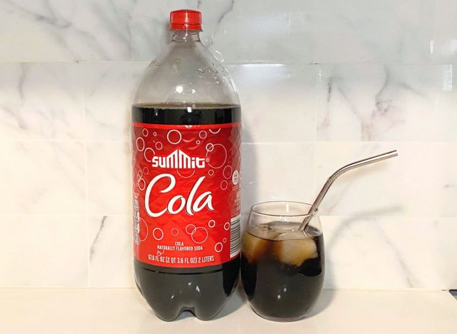 Summit Cola bottle next to glass filled with soda