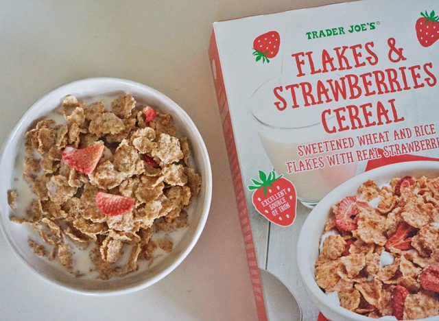 trader joe's flakes and strawberries cereal box and bowl.