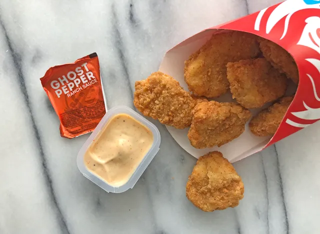 wendy's ghost pepper sauce with nuggets spilled out on a table. 