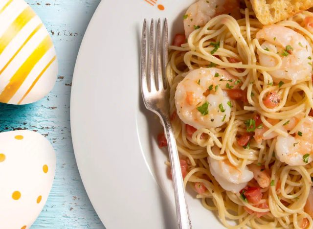 bravo italian kitchen's plate of shrimp pasta dish next to two easter eggs