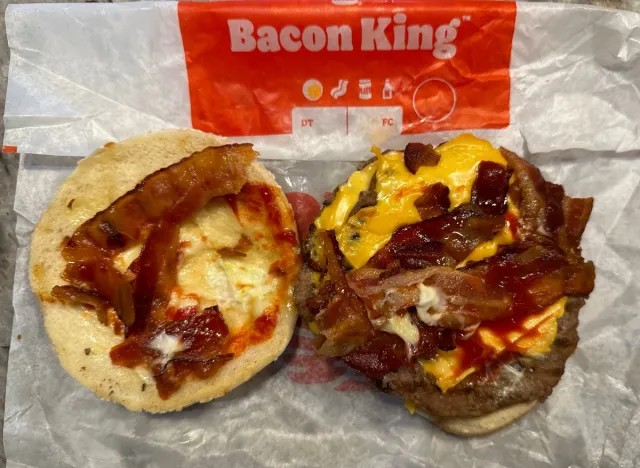 burger king bacon kng burger open on a wrapper.