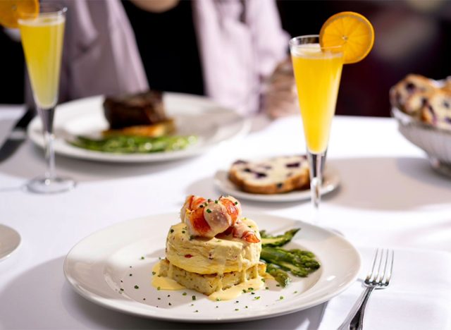 capital grille's lobster frittata and mimosas on a white tablecloth