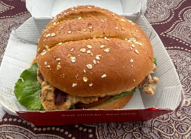 chick-fil-a grilled chicken sandwich in a takeout container.