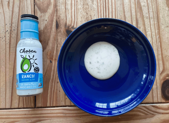 chosen ranch dressing bottle and on a blue plate.