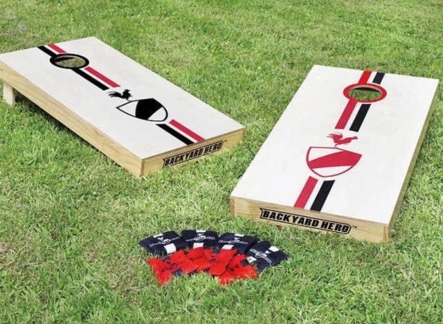 a cornhole set sold at costco on a lawn.