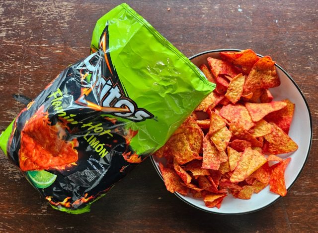 doritos flamin hot in a bag and a bowl.