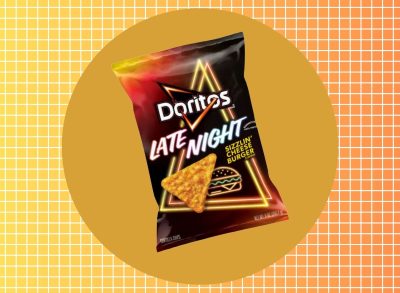 a photo of doritos late night sizzlin' cheese burger chips on a colorful designed background