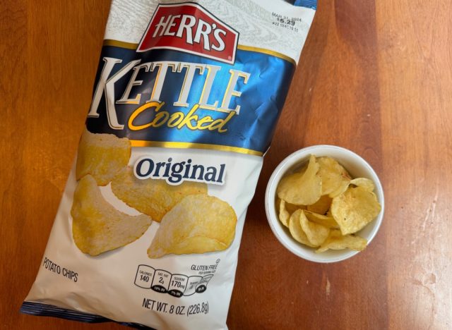 herrs kettle chips in a bag and a bowl.