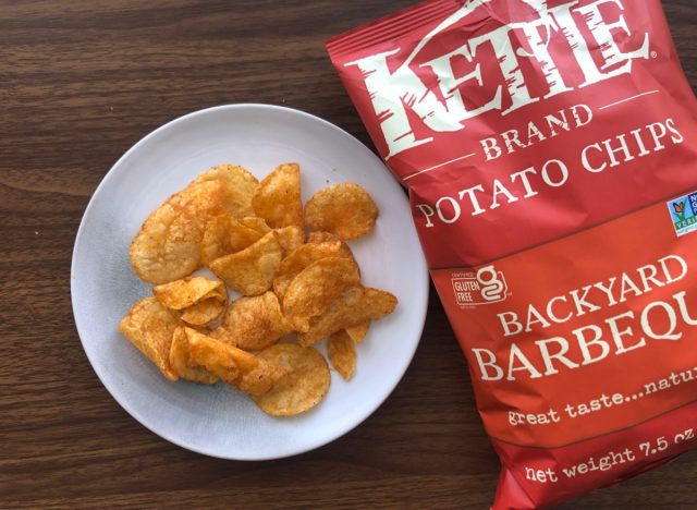 kettle bbq potato chips on a plate and in a bag.