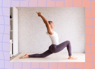 blonde woman with purple leggings and white tank doing low lunge stretch at home on cream-colored rug in bright living space