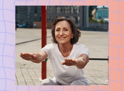 mature happy woman in her 60s doing squats outdoors at a park