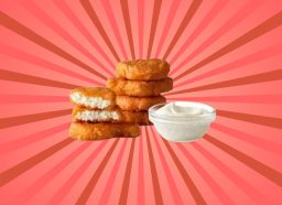 a photo of mcdonald's spicy chicken mcnuggets on a designed red pinwheel background