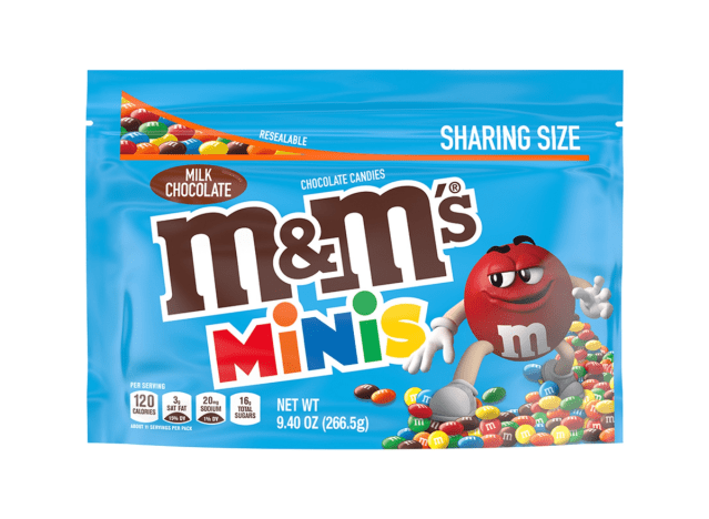 a bag of milk chocolate m & m minis on a white background.