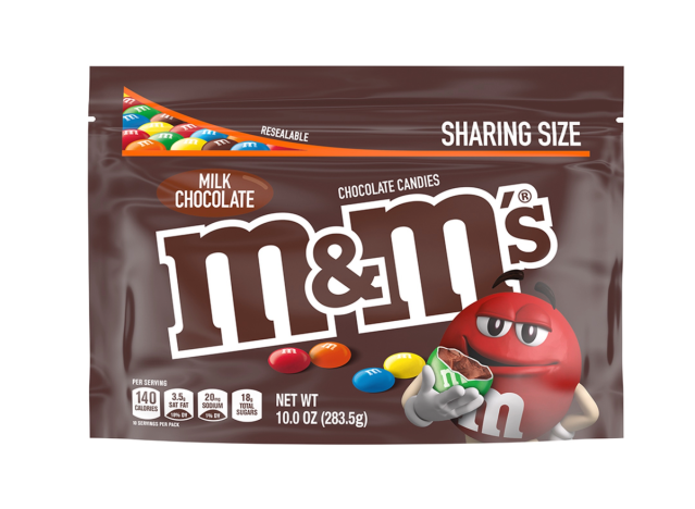 a bag of milk chocolate m & m's on a white background.