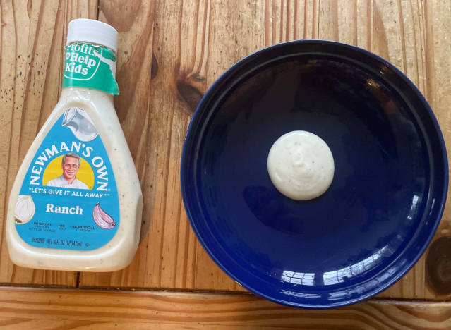 newman's own ranch bottle and blue plate. 