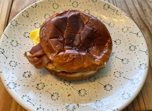 panera bacon egg and cheese brioche on a printed plate.