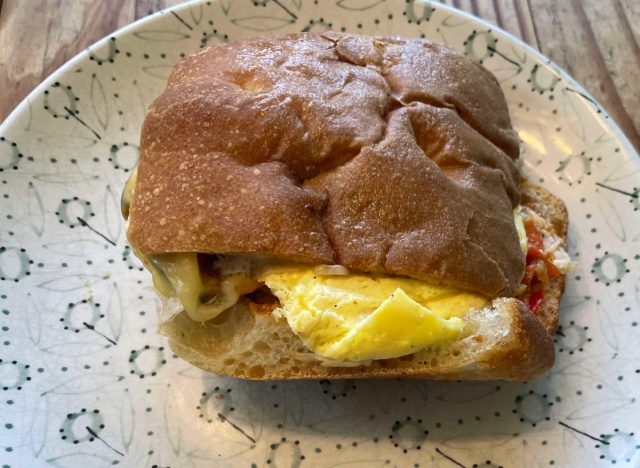 panera chipotle chicken egg avocado on a printed plate.