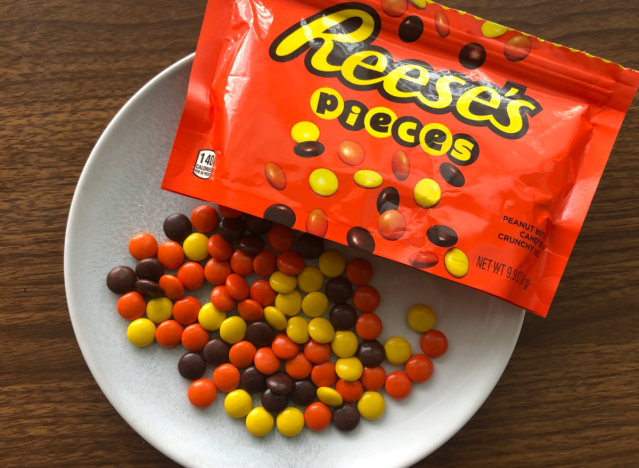 reeses pieces spilled out onto a table.