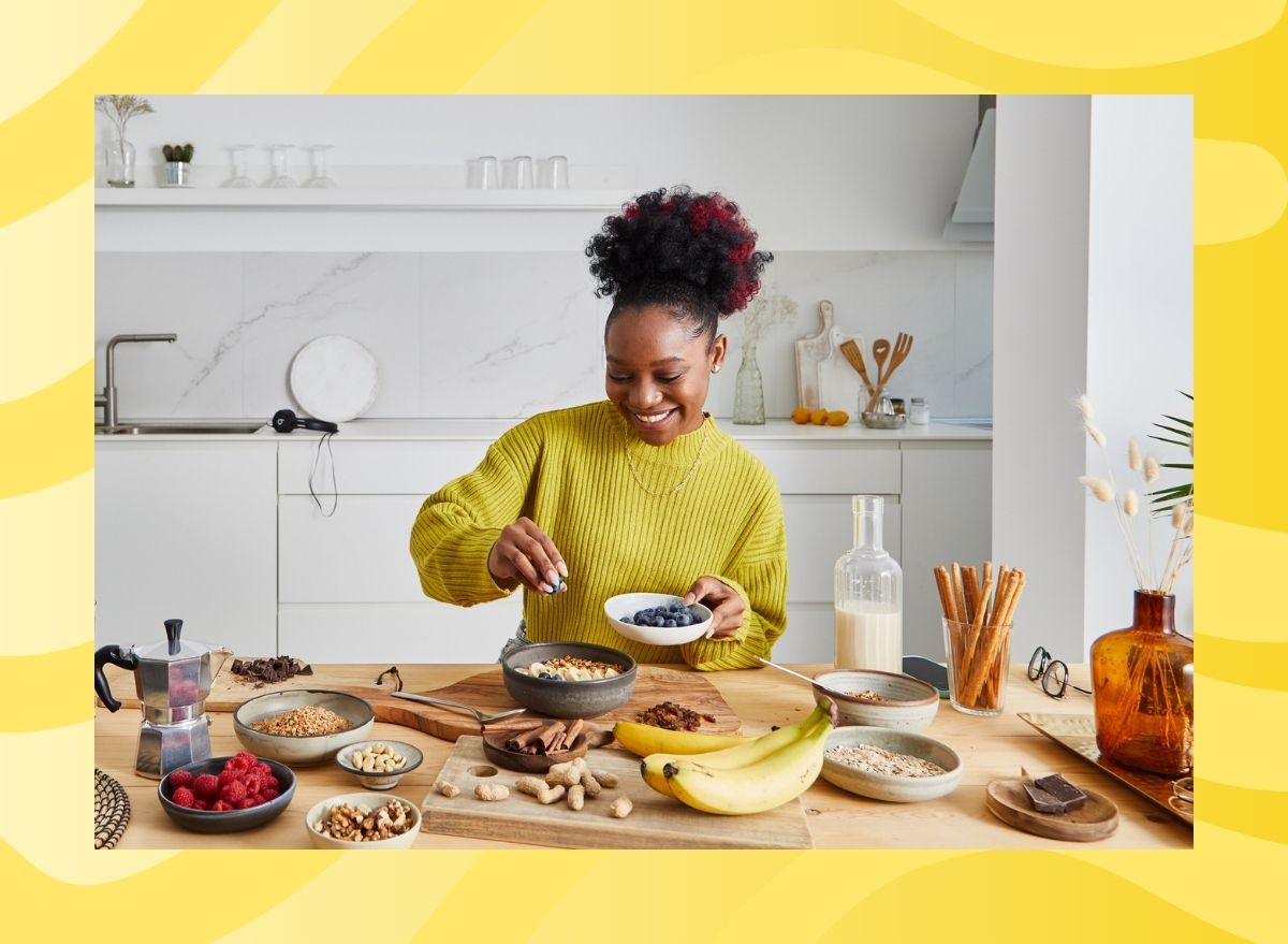 a woman cooking healthy food on a yellow background