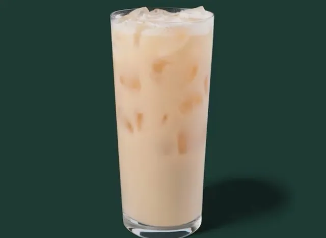 starbucks iced london fog tea latte on a green background.