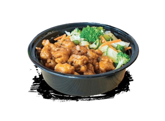 teriyaki madness orane chicken, rice and broccoli in a takeout container.