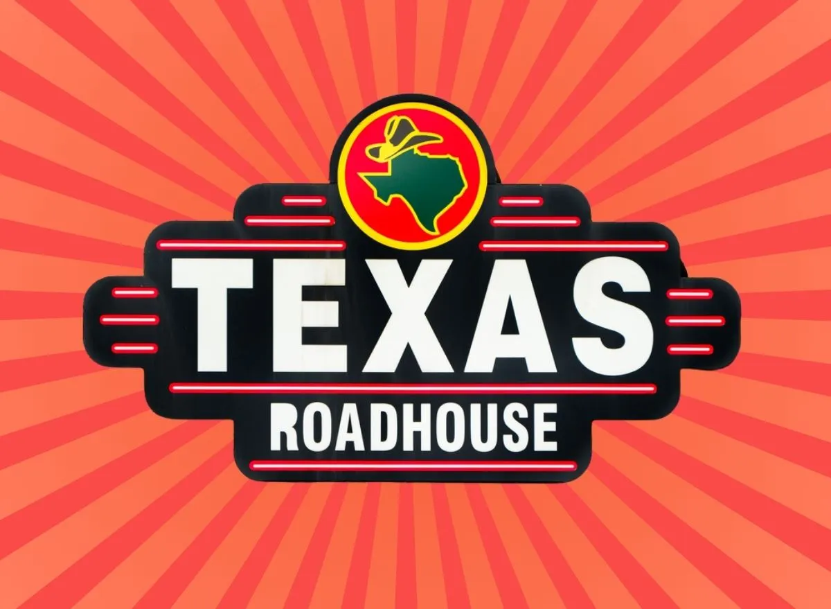 Texas Roadhouse sign on a red striped background