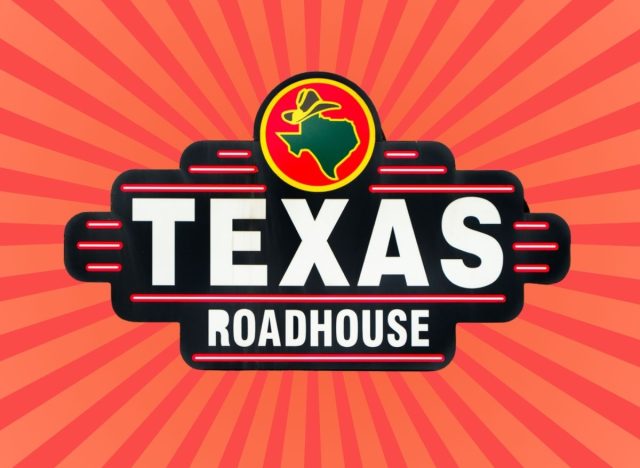 Texas Roadhouse sign on a red striped background