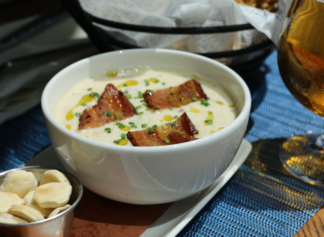 the banks chowder in a bowl garnished with bacon.