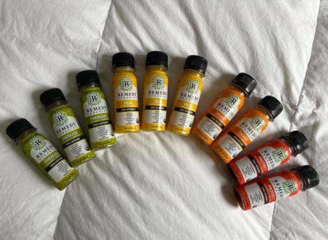wellness shots lined up on white comforter