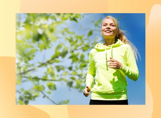fit blonde woman in lime green sweatshirt running outdoors on sunny day