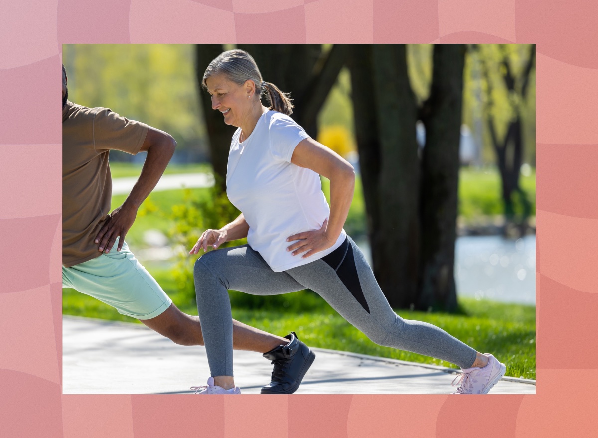 mature woman doing walking lunges in the park on a sunny day