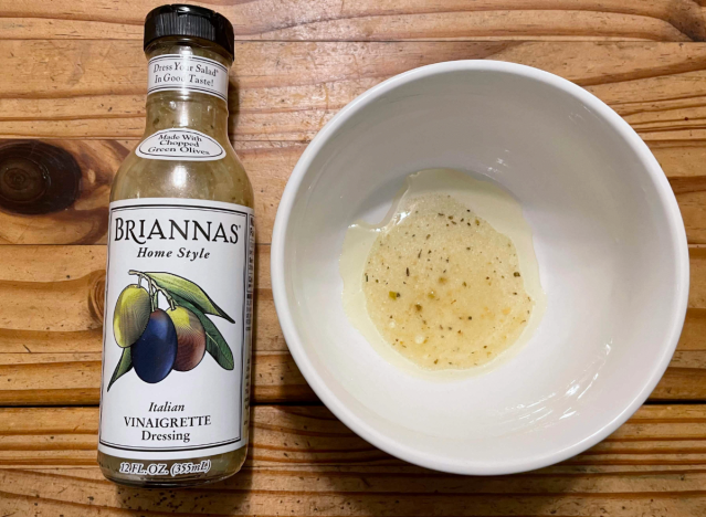 a bottle of brianna's dressing with a bowl beside it.