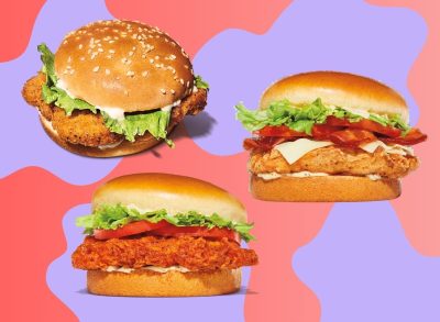 A trio of Burger King chicken sandwiches against a colorful background