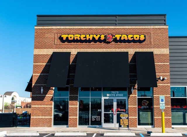 The storefront of a Torchy's Tacos location