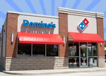 Domino's storefront with striped blue background