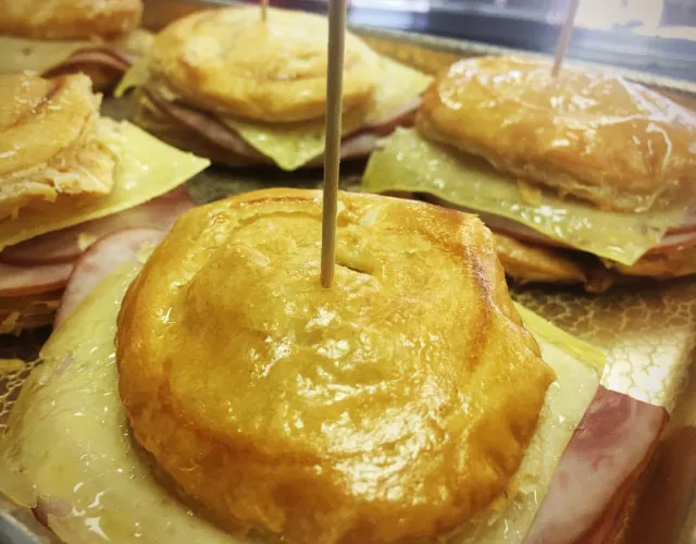 Ham and cheese stuffed into a meat pastry, aka "Preparadito," at El Brazo Fuerte Bakery in Miami