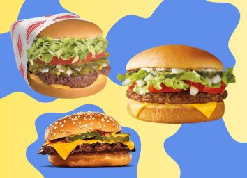 A trio of fast-food cheeseburgers against a colorful background