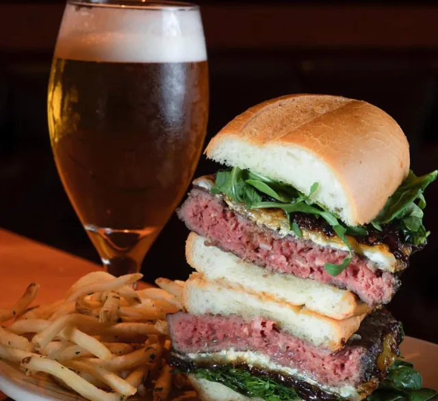 The Office Burger with fries and beer at Father's Office in Santa Monica, Calif.