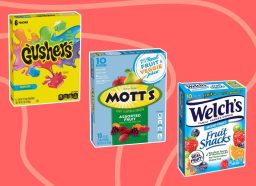 three boxes of fruit snacks on a pink background