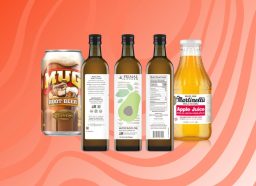 Mug Root Beet, Primal Kitchen Avocado Oil bottles, and Martinelli's apple juice bottle on patterned red background