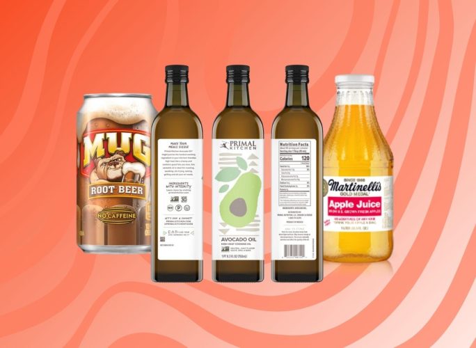 Mug Root Beet, Primal Kitchen Avocado Oil bottles, and Martinelli's apple juice bottle on patterned red background