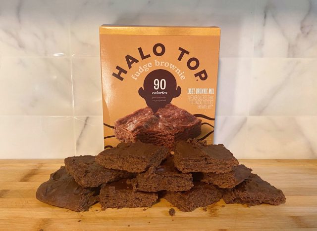 Halo Top Fudge Brownies and box on a wooden cutting board