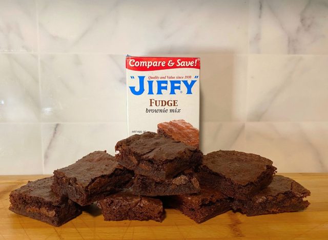 Jiffy Fudge Brownie brownies and box on a wooden cutting board