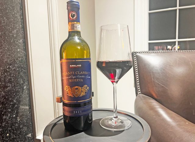 Costco's Kirkland Signature chianti bottle and glass on table.