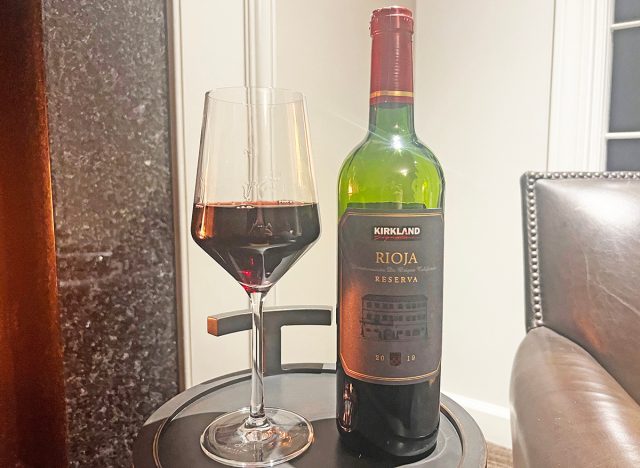Costco's Kirkland Signature rioja wine bottle and glass on table.