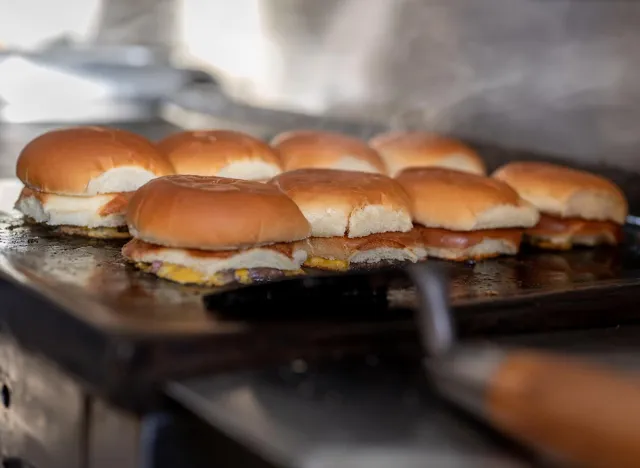 Bburgers on a hot griddle at Laha's Red Castle.