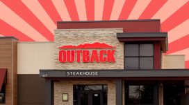 front of Outback Steakhouse restaurant on pink and red background