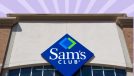 The storefront of a Sam's Club warehouse against a colorful background