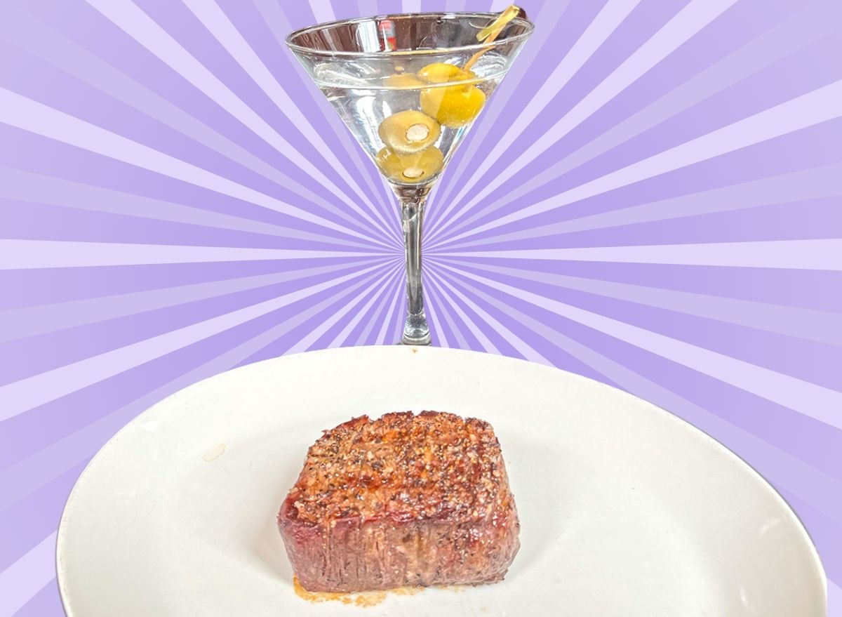 A plate of filet mignon and a martini against a colorful background.